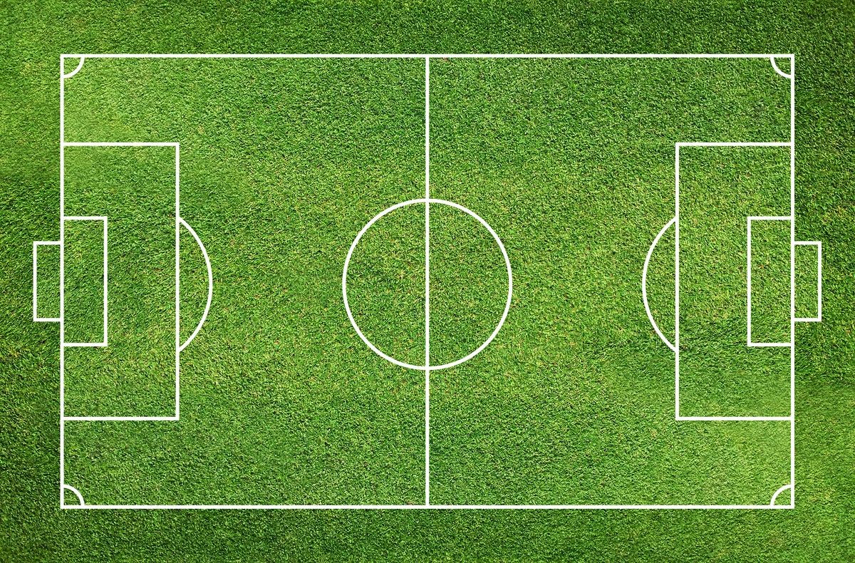 Football field or soccer field with green grass pattern and texture for background.